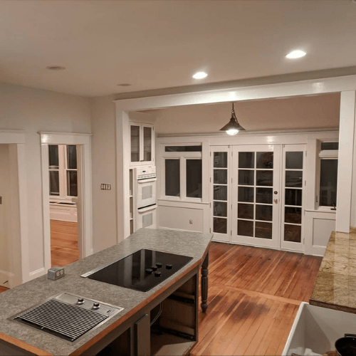 Spare white looks gray on walls in a kitchen