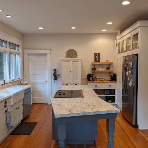 Spare white looks gray on walls in a kitchen