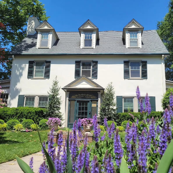 Sherwin Williams lookalike Prentiss Cream on a stucco exterior.