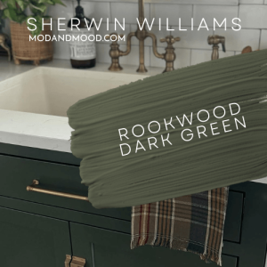 Swatch of Rookwood Dark Green over a photo of the color on cabinets below a sink.