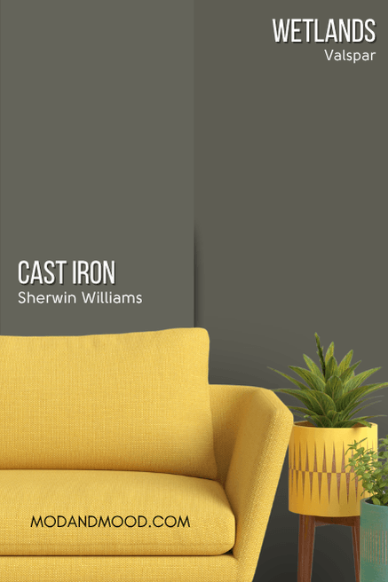 Sherwin Williams Cast Iron on half of a wall and dupe Valspar Wetlands on one half behind a mustard sofa.
