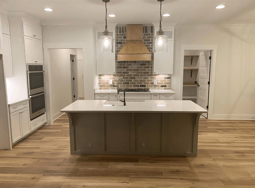 Sherwin Williams Spare White walls with Pure white trim in a kitchen.
