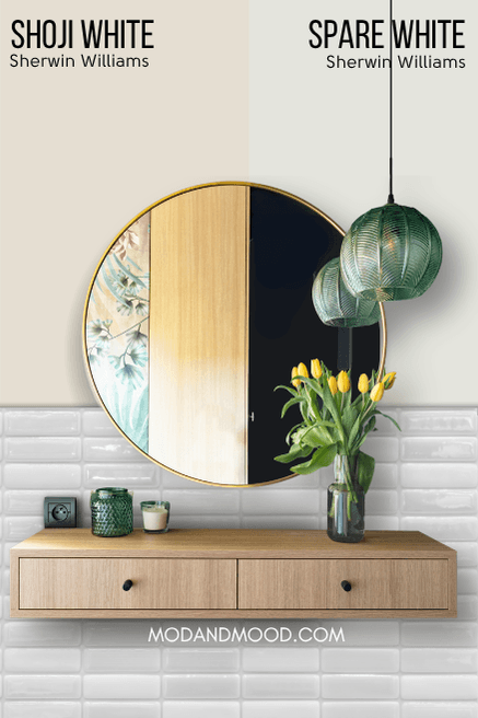 Sherwin Williams Spare White on one half of a wall and Shoji White on the other half behind a round mirror and wood vanity