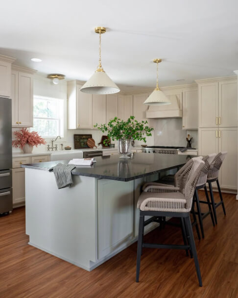 Sherwin Williams Natural Linen on kitchen cabinets with Austere Gray island.