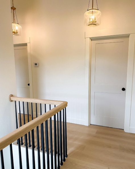 Benjamin Moore Balboa Mist on interior doors in a hallway with swiss coffee walls