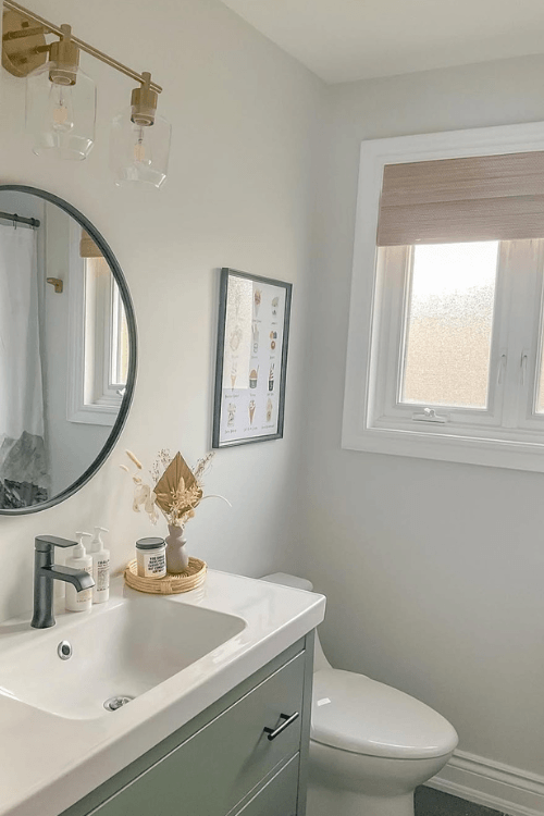 Sherwin Williams Spare White looks more gray in a bathroom with retreat on a vanity