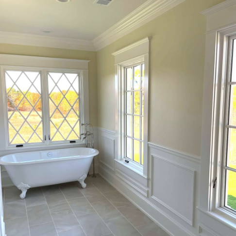 Benjamin Moore alabaster on wainscoting in a yellow bathroom