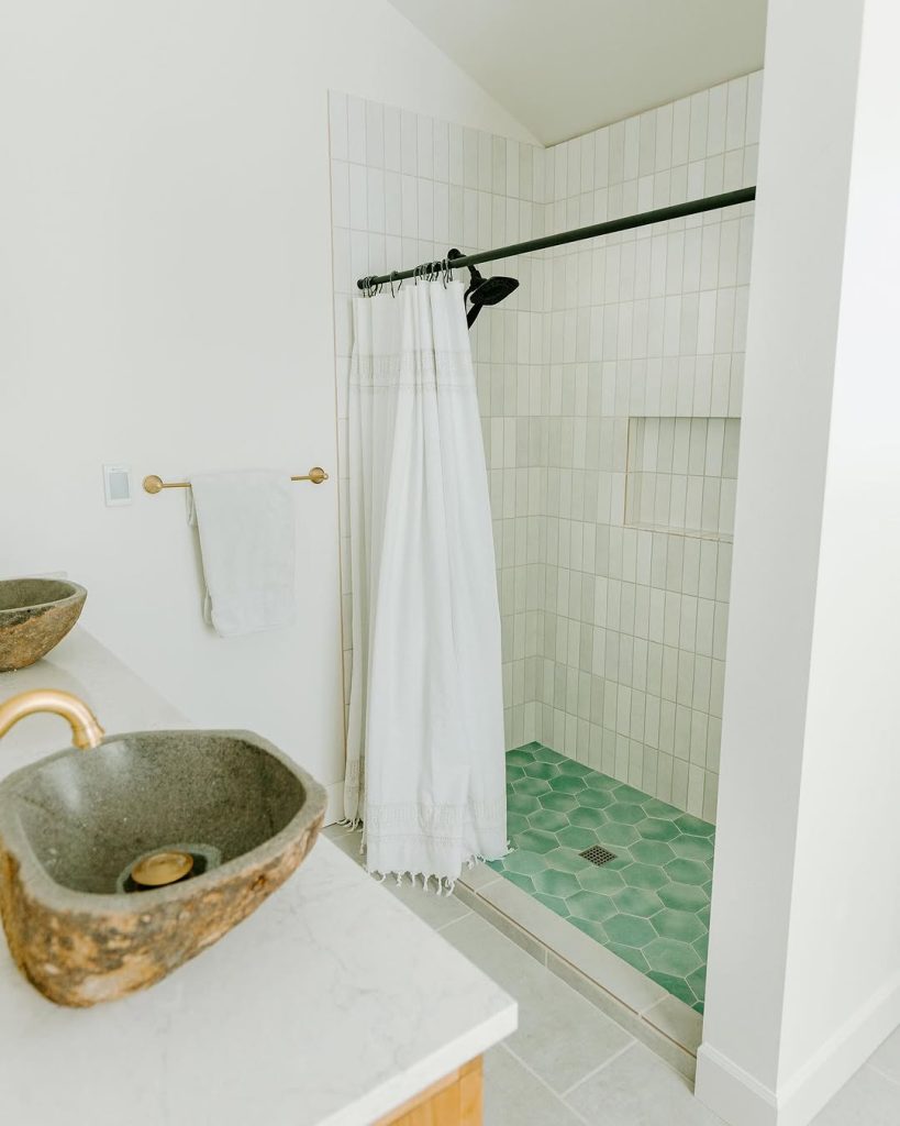 Benjamin Moore Swiss Coffee on walls in a bathroom against cool gray white shower tile