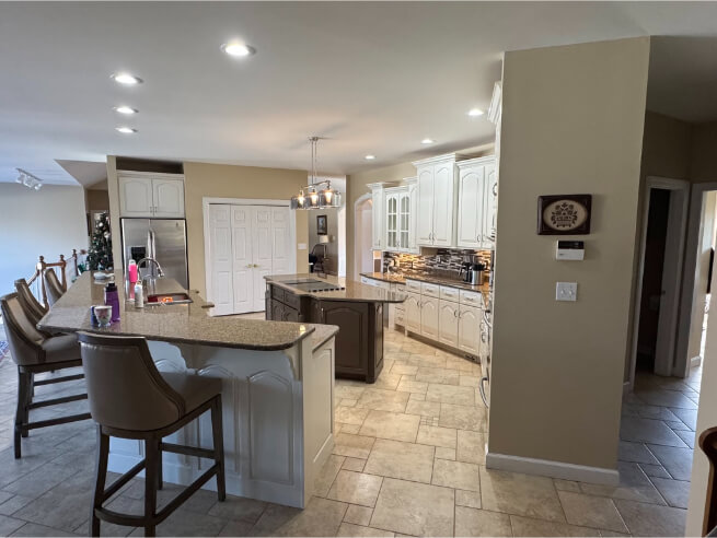 Sherwin Williams Greek Villa on perimeter cabinets with sable on an island