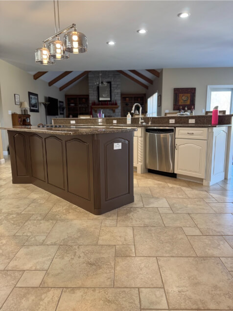 Sherwin Williams Sable on an island in an open plan home with Greek Villa cabinets