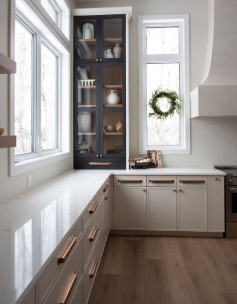 benjamin Moore wind's breath on lower cabinets where it looks like a smooth taupe.