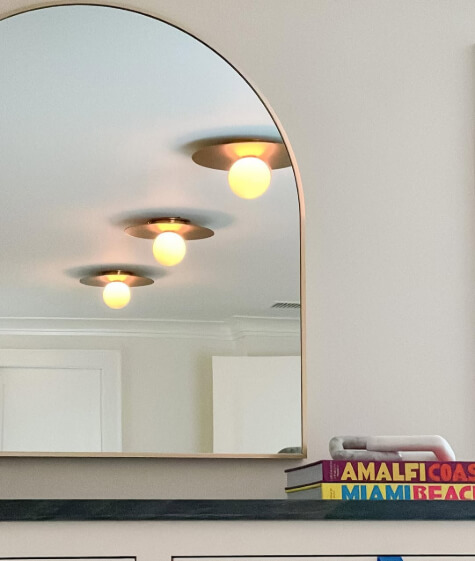 Sherwin Williams Swiss coffee on walls and reflected in a mirror with white dove on trim.