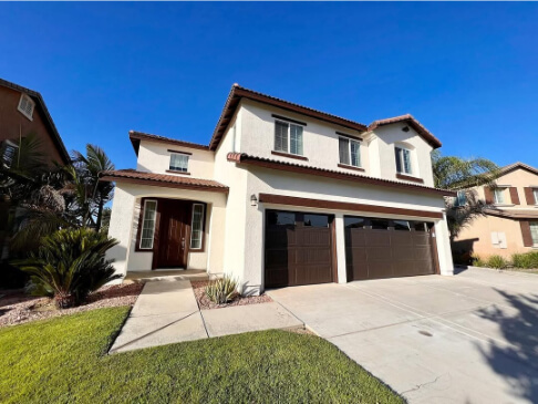 Sherwin Williams Creamy with Turkish Coffee where it looks like sable on garage and front doors.