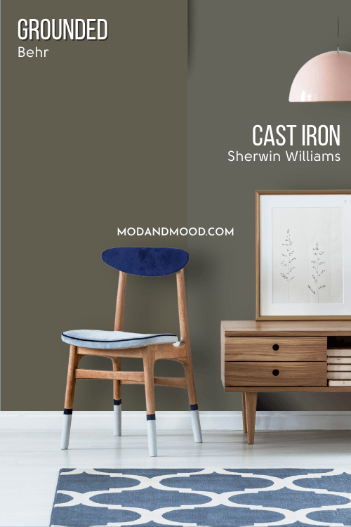 Sherwin Williams Cast Iron on half of a wall and Behr Grounded on the other half behind a wood console table and blue wood chair.