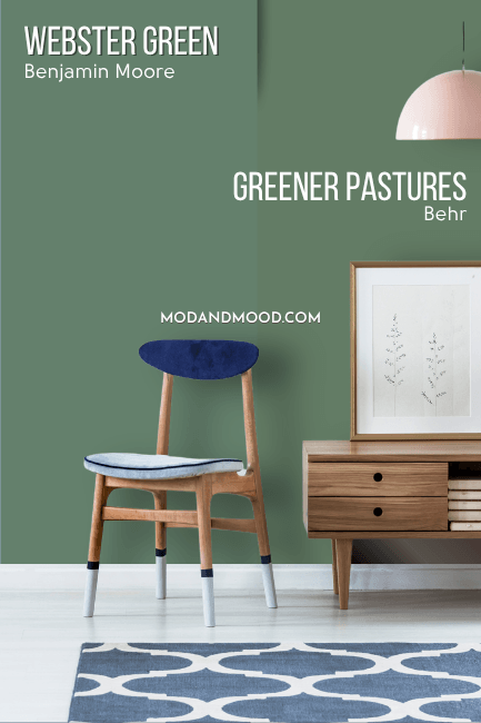 Benjamin Moore Webster Green on half of a wall and Behr Greener Pastures on the other half behind a wood console table and a small chair